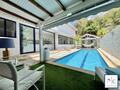 Luxueuse maison de ville 248m² avec piscine, local professio